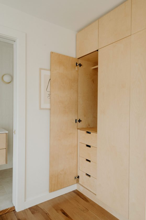 Built-in minimalist wood closet cabinet details